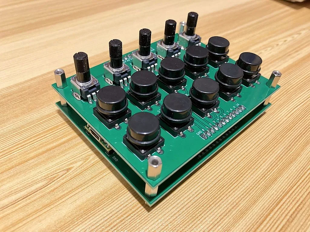 MIDI Controller Bottom and Top PCBs Stacked (Left Side) MIDI Controller Bottom and Top PCBs Stacked (Left Side)